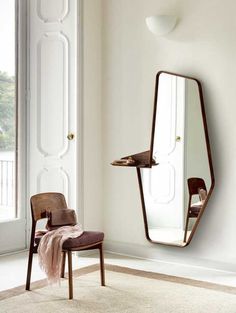 a mirror and chair in a room