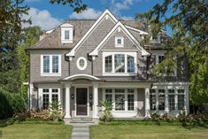 a large white house with lots of windows