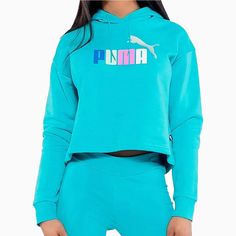 The Puma Women's Ess Cropped Logo Hoodie offers a comfortable and stylish choice for your workout wardrobe. With a cropped design and the iconic Puma logo, this hoodie provides both a range of motion and a fashionable look. Made from high-quality materials, it promises to keep you warm and comfortable during your workouts. More Details Color: Teal Style: 586869-97 Essentials Logo, Puma Sweatshirt, Black Sweats, Puma Logo, Color Block Jacket, 1 Logo, Sweat Hoodie, Puma Women, Women Essentials