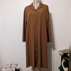 For Size Reference Was Modeled On A Small Mannequin. Brand New With Tag, Never Worn. There Is No Care Tag. Kind Of A Caramel Brown, Long Sleeves, Collar, And Buttons Down The Front. Simple Straight Dress, Below The Knee. Length Is 41", Pit To Pit Is 29", Size Medium. Easily Dressed Up Or Down, Work, Office, Business Wear, Add A Belt Or Sash, Lightweight. Collared Shift Shirt Dress With Buttons, Collared Shift Shirt Dress For Daywear, Brown Long Sleeve Shirt Dress For Work, Brown Long Sleeve Shirt Dress For Spring, Brown Long Sleeve Dress With Button Closure, Formal Brown Shirt Dress, Formal Brown Collared Dress, Brown Button-up Midi Dress For Daywear, Long Sleeve Shift Midi Dress For Daywear