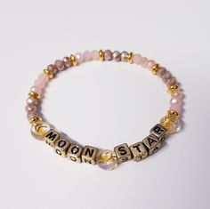 * D E S C R I P T I O N: This custom bead bracelet is an informative and fun bracelet that can show your personality. So many options and colors to pick from. Use your name, initials, your kiddos, pet names, motivation words, phrases - options are endless! These also make perfect gifts for - mamas to be, baby shower, bridal, bachelorette party, best friends, etc. ✿ Kindly note the listing price is for one bracelet, photos with multiple bracelets is to show different styles only. ✿ Use the personalize box at checkout to list , words. (words, initials or name) Too much text will not make the bracelet design look pretty. * C O L O R S: Gold, Beige & Pink * D E T A I L S: -Acrylic Beads (4mm Square, 6mm Round)  -BBC Resin beads -Crystal beads -Clear Elastic Cord -Length is optional * P A C K I Party Best Friends, Initials Bracelet, Motivation Words, Single Bracelet, Multiple Bracelets, Bridal Bachelorette Party, Sister Bracelet, Fun Bracelet, Word Bracelet