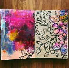 an art journal is open on a wooden table and has flowers painted on the pages