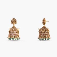 Description: Indulge in the epitome of elegance with our captivating antique gold-plated 925 silver jhumka earrings. Masterfully handcrafted, these earrings feature intricate peacock and floral motifs, dazzling Kempu stones, CZ stones, and bead drops. The stud part features the Goddess Lakshmi motif each detail reflects timeless luxury and charm. Product Information: Metal: 925 Silver with Antique Gold Plating Length: 5cm Stones: High Grade CZ Stones Findings: Push back Antique Gold Lakshmi Earrings, Festive Temple Jewelry Danglers With Intricate Design, Intricate Temple Jewelry Danglers For Festive Occasions, Ornate Brass Chandbali Jhumkas, Yellow Gold Bollywood Jhumkas With Intricate Design, Bollywood Style Yellow Gold Jhumkas With Intricate Design, Ornate Brass Jhumkas For Festive Occasions, Ornate Brass Jhumkas For Festive Season, Ornate Brass Jhumkas For Wedding