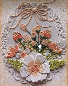 an ornate card with flowers on it