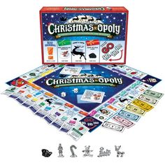 the christmas monopoly board game is shown in front of it's box and contents