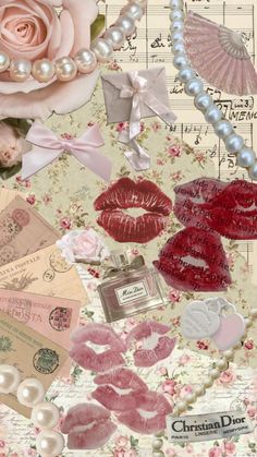 a collage of pink roses, lipstick, pearls, and other items on top of sheet music