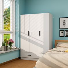 a bedroom scene with focus on the bed and cupboards against the wall, near a window