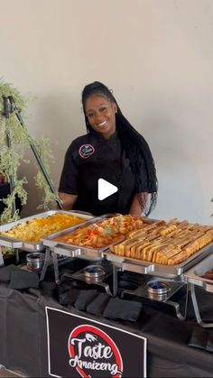 a woman standing in front of a buffet table filled with food