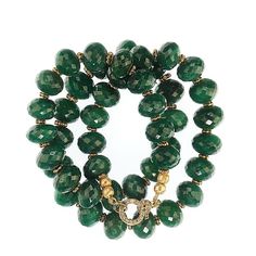 This is part of Chairish’s Fine Jewelry assortment.  18 Inch slightly oval, not quite round faceted emerald necklace. There are tiny goldy daisies accenting the glitter of the emerald facets. All you emerald lovers are in luck with this beauty, it will be your 'go to' necklace from now on.  It's the perfect 18 inch length and just the most gorgeous emerald green. It is finished with a diamond chip studded gold vermeil easy to use clasp. Emerald is the May birthstone.  What a great birthday present!! Green Emerald Necklace With Faceted Beads, Faceted Green Oval Beaded Jewelry, Rondelle Green Emerald Jewelry, Luxury Green Faceted Necklaces, Luxury Faceted Green Necklace, Luxury Green Faceted Necklace, Rondelle Emerald Necklace For Gift, Emerald Rondelle Faceted Beads Jewelry, Faceted Emerald Necklaces With Round Beads