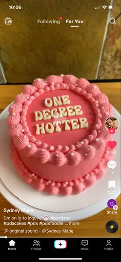 a pink cake with the words, one degree hotel on it's front and side