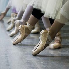 some ballet shoes are lined up in a row with the words, ballerina thing fo