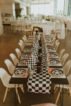 a long table with black and white checkered runneres