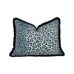 a blue and black pillow with a leopard print pattern on the front, sitting on a white background