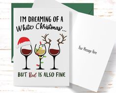 two wine glasses with santa hats on them and the words i'm dreaming of a white christmas but red is also fine