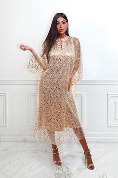 Featuring: Sequin, pearl beading. Bell sleeves Band collar Brand: Unmatched BYUMatch it with a slip dress - The model is wearing a slip dress (Shop slip dresses)Size: Free Size. "fits sizes between 2 (US) up to 24 (US)"Exact Caftan Measurements: Mini LengthLength: 35.5 (Inches)Bust: 52 (Inches)Hem: 59 (Inches)Midi LengthLength: 50 (Inches)Bust: 50 (Inches)Hem: 72 (Inches) Glamorous Embellished Festive Midi Dress, Festive Embellished Glamorous Midi Dress, Festive Sequin Midi Dress For Wedding, Festive Sequined Midi Dress, Festive Evening Midi Dress With Sequins, Festive Midi Dress With Sequins For Evening, Festive Sequined Midi Evening Dress, Festive Gold Midi Dress For Evening, Long Sequined Dress For Wedding