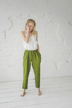 "DETAILS * Loose linen pants * With the elastic band around and two side pockets * Relaxed fit at the above and tapered bottomms * Made from soft wash medium weight (185 gsm) 100 % European linen fabric * Height of the model is 175 cm (5′ 9″) and she is wearing pants in size XS and natural gray stipes colors * Pants inner seam - 74 cm / 29.1''; pants outer seam - 106 cm / 41.7'' * Please choose another color and size on the right * Product number: P04 CARE LABEL * machine wash gentle (40 C/104 F Relaxed Green Bottoms With Pockets, Green Linen Harem Pants With Elastic Waistband, Relaxed Fit Summer Pants With Slip Pockets, Linen High-waisted Bottoms With Side Pockets, Green Linen Bottoms With Side Pockets, Green Tapered Leg Pants For Everyday, Everyday Green Tapered Leg Pants, Summer Linen Tapered Pants, Linen Pants With Tapered Leg And Pockets