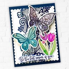 a card with butterflies and flowers on it