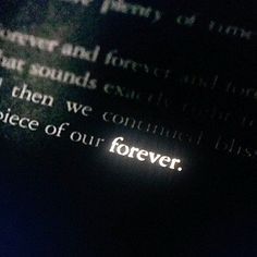 the word forever is projected on a piece of paper