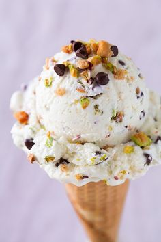 two scoops of ice cream with nuts and chocolate chips