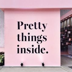 a pink sign that says pretty things inside