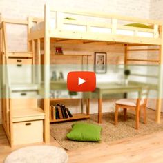 a room with bunk beds and desks in it