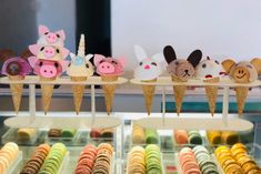 an assortment of ice cream cones with animals on them