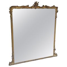 an ornate gold framed mirror on a white background