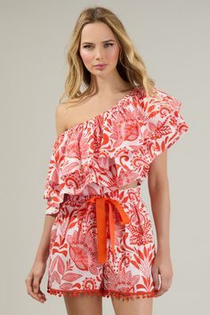 The Juny Floral Charmer One Shoulder Ruffle Top is calling your name! A tropical fun print highlights a single shoulder with exaggerated ruffle layers. The bodice maintains a cropped and voluminous fit with elastic casing along the bottom edge. Wear it with pants, sandals and your sunnies for a complete look! - Cropped- Ruffle layers- Elastic casing - One shoulder- Color: White RedSize + Fit - Model is 5'8" and wearing size XS- Measurements taken from size S - Chest: 35" - Length: 18" Fabric Sel Summer One Shoulder Crop Top For Day Out, Summer One-shoulder Crop Top For Day Out, One Shoulder Crop Top For Summer Day Out, Casual Sleeveless One Shoulder Top For Vacation, Casual Sleeveless One-shoulder Top For Vacation, Casual Cropped One Shoulder Top For Summer, Off-shoulder Beachwear Tops For Beach Season, Summer Off-shoulder Crop Top For Vacation, Casual One Shoulder Top With Ruffles