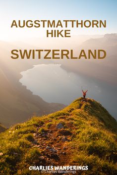 a person standing on top of a grass covered hill with the words, ausmathorn hike