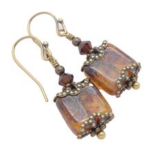 "These are fairly small Neo Victorian earrings with 10mm marbled brown Czech glass weathered tile beads inside antiqued brass filigree bead caps and topped them with mocha brown top quality crystals.  The larger beads often have occasional spots of an almost iridescent purply-blue that makes them feel so timeworn.  They're gorgeous!   These boho earrings are hung on quality solid brass french hook or leverback earwires, or niobium french hooks for 50 cents more.  . Length: About 1-1/2\" (4.3 cm) Elegant Brown Soldered Jewelry, Brown Bead Caps For Jewelry Making, Elegant Brown Czech Glass Earrings, Nickel-free Brown Czech Glass Jewelry, Vintage Copper Brown Earrings, Vintage Brown Copper Earrings, Vintage Bronze Beaded Earrings, Vintage Beaded Bronze Earrings, Nickel Free Brown Earrings With Czech Glass