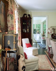 a living room filled with furniture and decor