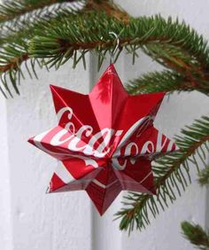 a coca cola ornament hanging from a christmas tree