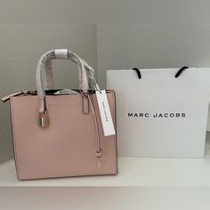 Marc Jacobs Mini Grind Bag. New Daily Use Tote Box Bag With Branded Hardware, Satchel Box Bag With Branded Hardware For Shopping, Shopping Satchel Box Bag With Branded Hardware, Branded Hardware Satchel Box Bag For Shopping, Everyday Double Handle Box Bag With Branded Hardware, Double Handle Box Bag With Gold-tone Hardware For Errands, Chic Tote Box Bag With Branded Hardware, Chic Box Bag With Gold-tone Hardware, Chic Box Bag With Gold-tone Hardware For Errands