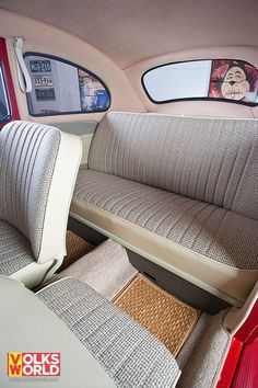 the interior of an old car with two seats