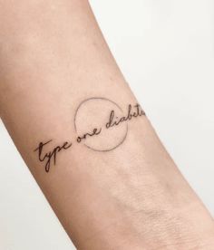 a woman's arm with the word type one daddy written in cursive font