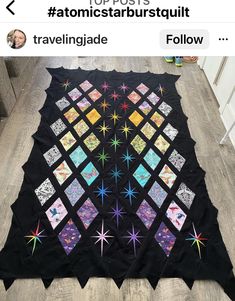 a black quilt with colorful stars on it and the words, top posts atomic starburst