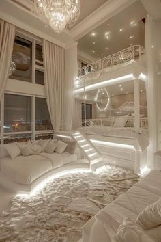 a large white bed sitting in the middle of a bedroom next to a tall window