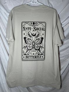 Super comfy tan colored t-shirt with black glitter vinyl butterfly design Graphic Tee With Butterfly Print For Streetwear, Casual Butterfly Print T-shirt For Streetwear, Anti Social Butterfly, Butterfly T Shirt, Social Butterfly, Glitter Vinyl, Anti Social, Black Glitter, Butterfly Design