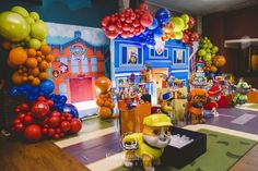 a room filled with balloons and stuffed animals