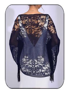 the back of a woman's blouse with lace and flowers on it