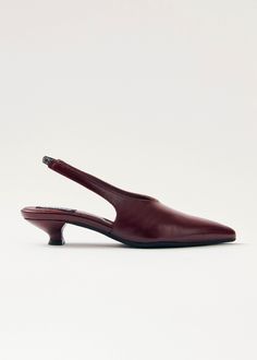 Burgundy crinkle-effect leather slingback pumps Crafted from burgundy crinkle-effect leather, the Eros pumps rest on a low 4mm heel and feature an elasticated slingback strap, ensuring non-negotiable comfort. The sharply pointed toe and minimalist, long vamp add the touch for an elegant silhouette. Finnish Fashion, Hand Towels Kitchen, Black Leather Pumps, Weekender Tote Bag, Mary Jane Pumps, Boot Bag, Everyday Dresses, Slingback Pump, Dress Ideas