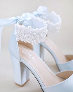 Satin block heel wedding sandals adorned with all over pearls ribbon strap . Elegance and feminine inspired wear for your special day. The delicate pearl beads are placed to create a graceful classic style. Simple and easy wear for bridal wear, bridesmaids, holiday party, wedding parties, and any special occasions. The light blue color can easily be your something blue.DETAILS:HEELS: 4 inchesCOLORS AVAILABLE: Ivory, White and Light BlueUPPER: Synthetic upper and liningMATERIALS: Manmade outsoleO Mid Calf Dresses, Purple Wine, Bridal Sandals, Drawstring Dresses, Christmas Gift Shop, Wedding Sandals, Wedding Parties, Bride Shoes, Boot Pumps