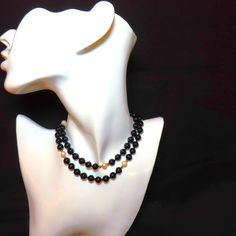 On offer is this vintage 1970's superb quality genuine Black Onyx, White Cultured Pearls and solid 14 karat yellow gold filigree Fish Hook clasp with solid 14k gold spacer beads. The large 8 mm gems glow with a very high polish which contrasts against the white of the cultured pearls which are perfectly matched and highlighted by the bright 14k gold spacer beads. In very good condition with no damage. The clasp has a safety latch and is hallmarked 14k. The length is a nice 24.5 inches. This neck Elegant Formal Jewelry With Black Beads, Elegant Black Beaded Jewelry For Formal Occasions, Elegant Formal Black Beaded Jewelry, Classic Black Round Beaded Jewelry, Classic Black Beaded Jewelry As Gift, Classic Onyx Round Bead Jewelry, Classic Onyx Round Beads Jewelry, Classic Onyx Necklaces For Formal Occasions, Classic Gold Jewelry With Black Beads