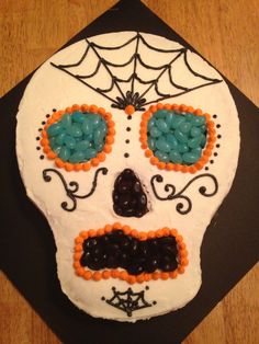 a decorated sugar skull sitting on top of a table