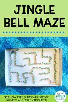 a box with some candy canes in it and the words, jingle bell maze