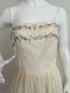 1950s Vintage Fit and Flare Floral Dress - 50s Ivory and Lace Vintage Garden Party Dress with Embroidered Flowers - Size S This dress is so pretty and perfect for summer! It has a satin skirt with a sheer overskirt featuring embroidered flowers and lace. The dress zips up the back and has a hook and eye closure.  This dress is in VG vintage condition commensurate with age. It has been carefully stored and comes from a smoke-free home.  Measurements:  45"L Bust: 36" Waist: 27" Vintage Garden Party, Dress With Embroidered Flowers, Vintage Garden Parties, Garden Party Dress, Lace Vintage, Vintage Fits, 50s Dresses, Vintage Garden, Satin Skirt