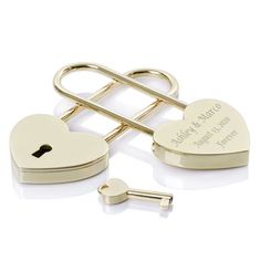 two heart shaped locks and key on a white background