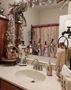 a bathroom decorated for christmas with decorations