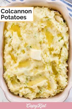 a casserole dish filled with potatoes and topped with cheese