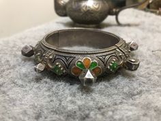 Antique Berber silver enamel bracelet from region Tafraout southern of Morocco. Dimensions: Inner diameter:5,6cm Width :2cm Weight : 92,2g African Bracelets, Moroccan Jewelry, Silver Heart Ring, Enamel Bracelet, Silver Enamel, Silver Coins, Silver Heart, Photo Jewelry, Handmade Ring